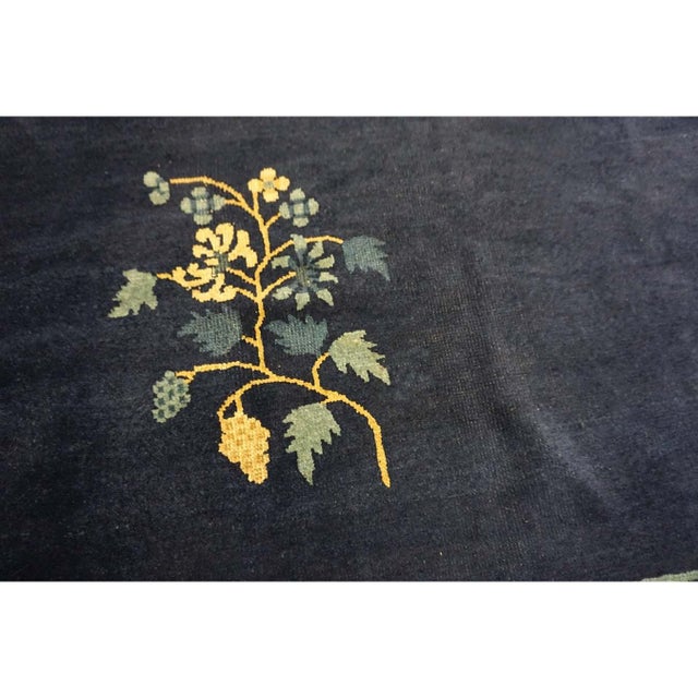 Rectangle Wool Antique 1920s Blue Hand Knotted Pile Floral Rug, Circa Date: 1920s. This exceptional piece represents the...