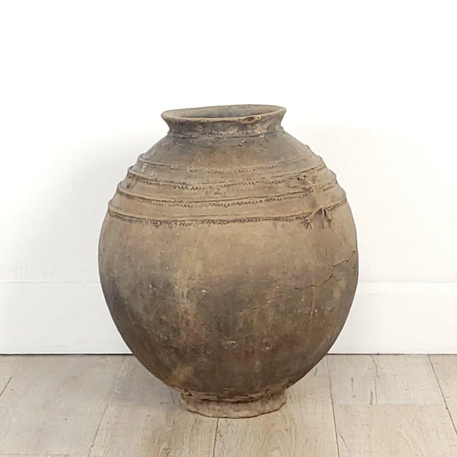 A large Indonesian earthenware water jug, 19th century or earlier.