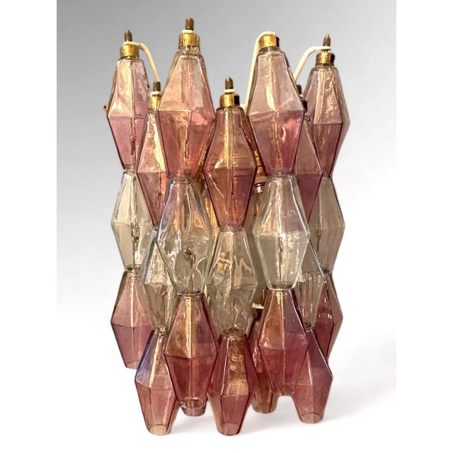 Amazing pair of poliedri wall lights. Rare combination of iridescent pink amethyst and clear color Murano glass. Available...