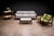 This bar cart is executed in solid caviúna wood, its structure defined by clean vertical supports and gently contoured...