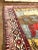 Old Handwoven Shiraz area rug featuring a beautiful pictorial design of four running horses elegantly framed by a...