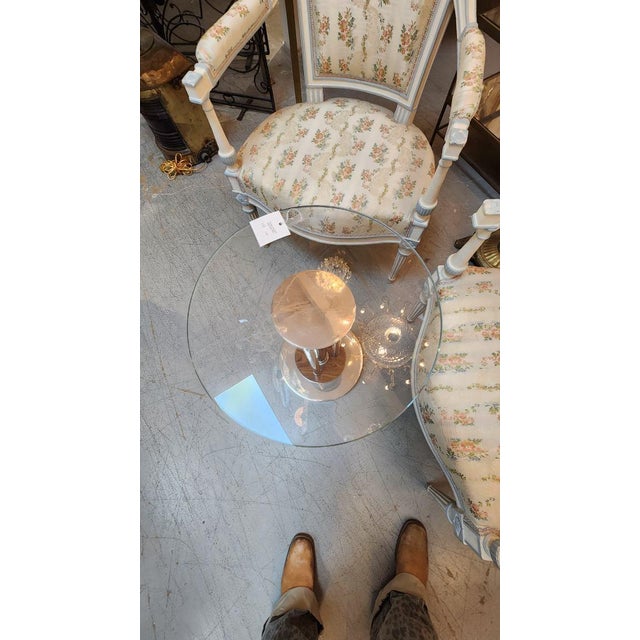 This listing features a unique wood and chrome side table; would modernize any space it is added to. Would pair great with...