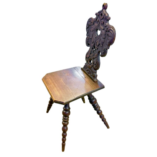 Antique hand-carved Welsh hall chair with hand-carved scrolled acanthus leaf design in relief surrounding four different...