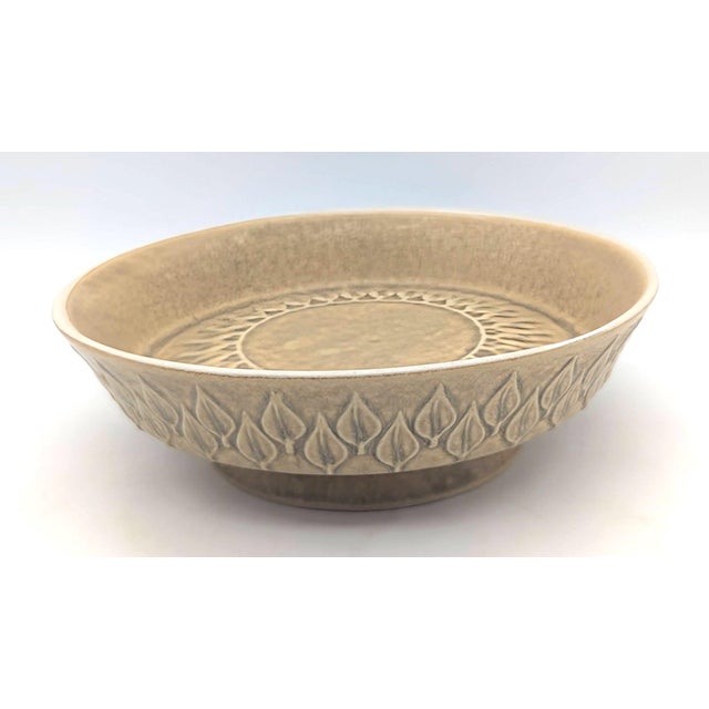 Offered is a vintage Jens H. Quistgaard "Relief" ceramic stoneware bowl featuring a distinct leaf pattern around the...