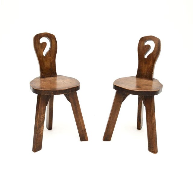 A charming and extremely well made pair of vintage Brutalist side chairs in solid elm. They were made in England, they...