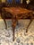 Antique Hand-Carved Rococo-Style Side Table with Cherub Figures & Marquetry Top An exceptional antique carved side table,...