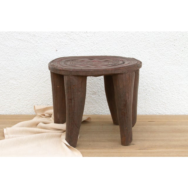 A unique piece of African art, this vintage Nupe table from Nigeria is a must-have for collectors and enthusiasts of Nupe...