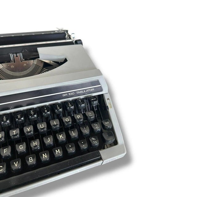 This portable typewriter is a Mid Century Silver Reed vintage mechanical writing machine designed for writers, collectors,...