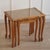 Decorative 3-piece set of stackable wooden nesting tables with glass top and fine Viennese weave. The vintage ensemble can...