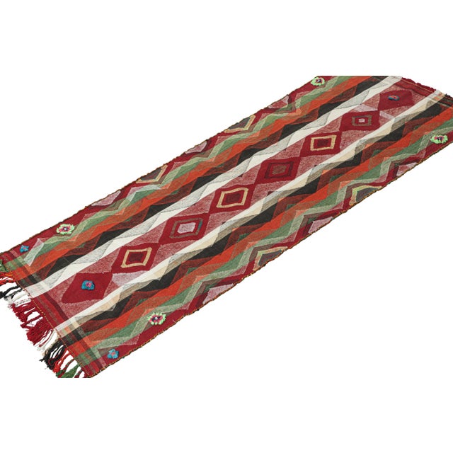 This vintage 3x8 Persian kilim runner is handwoven in wool, and originates circa 1950-1960. Its design is a panel-weave,...