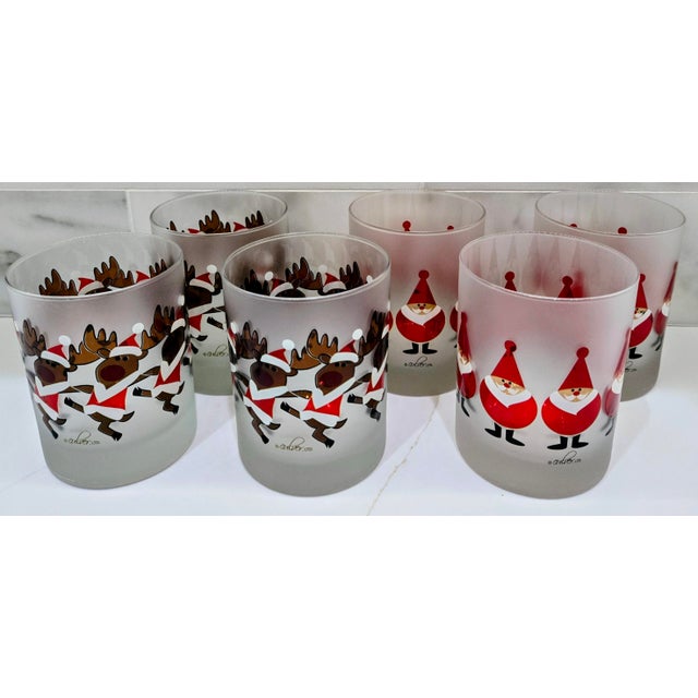 Bring cheerful mid-century holiday style to your bar cart with this set of six vintage Culver Ltd. Christmas tumblers. The...