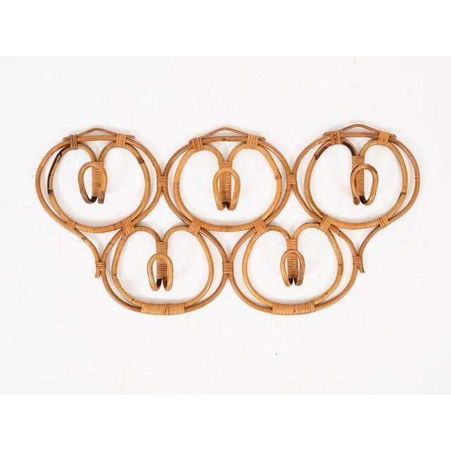 Gorgeous and very rare large organic coat rack, entirely crafted in curved rattan and hand-woven wicker. This wonderful...