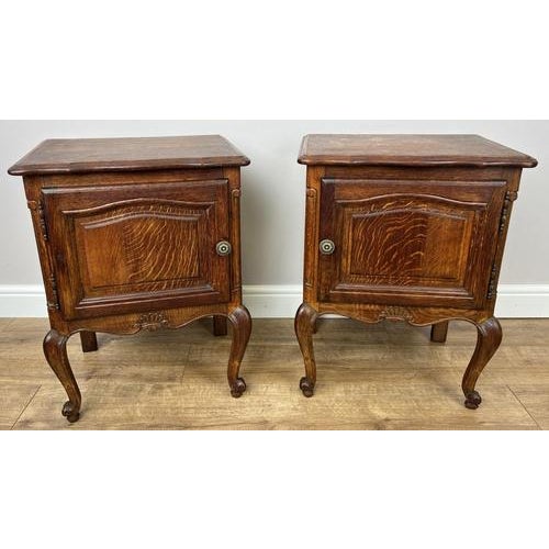 A charming pair of Vintage French Louis bedside tables , beautifully designed with elegant curves and a rich oak finish...
