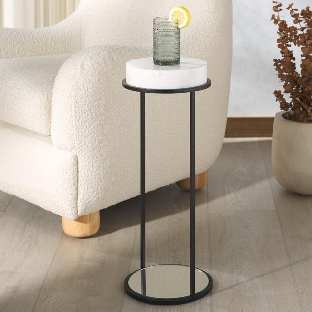 Embrace the sleek and sophisticated presence of our Jennibelle drink table. The table strikes an impact with its refined...