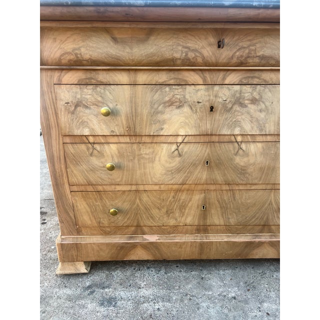 Elegant 19th-century French Louis Philippe commode crafted in richly figured walnut veneer with striking bookmatched...