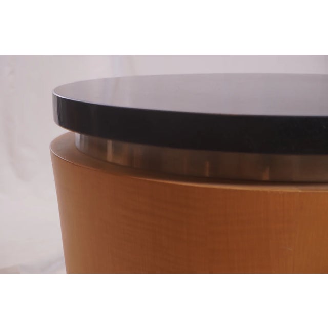 The Vintage Charles Alan Erik Drum Table from the 1990s features a bold cylindrical silhouette paired with refined...