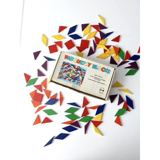 This is a set of mid-century parquetry blocks by the Marvel Education Company. The classic wooden toy blocks come in a...