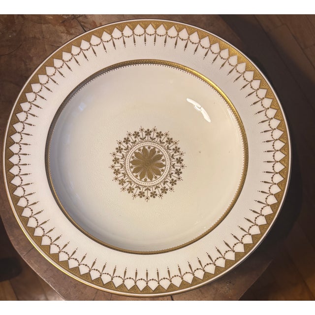 An elegant set of six antique porcelain soup bowls produced by Minton’s of England for Davis Collamore Co of New York....