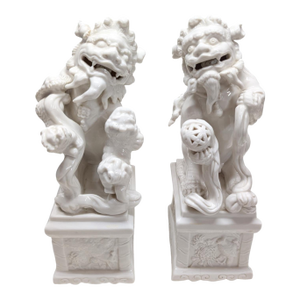 Pair of Vintage Chinese Porcelain Blanc De Chine Foo Dog Statues.