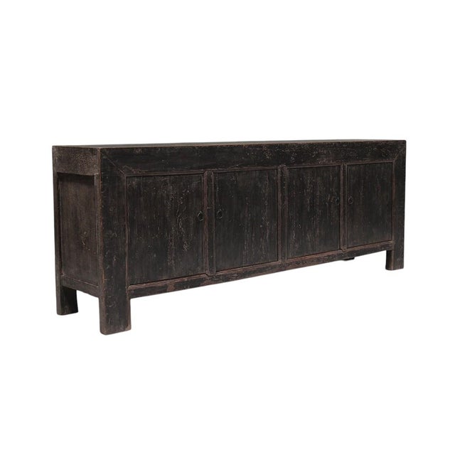 This vintage sideboard is made from reclaimed solid wood featuring a weathered, dark charcoal brown finish with rustic...