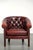 Cowhide Chesterfield club armchair in a sought-after and timeless red color. : This lovely, subtle cowhide Chesterfield...