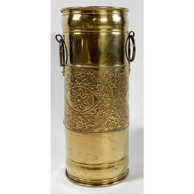 Elegant vintage brass umbrella stand featuring deep emboss floral motif to body with center medallions. Two exaggerated...