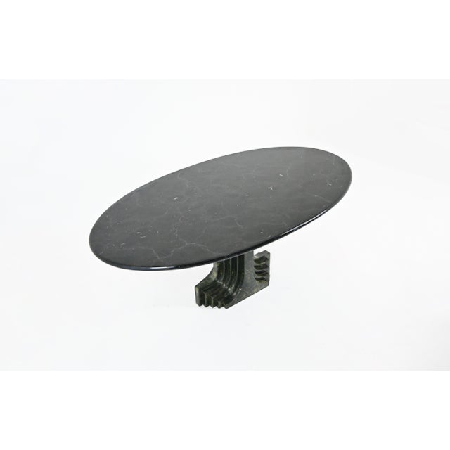 Green marble table designed by Carlo Scarpa. Model: Argo. Wear consistent with age and time. This piece is attributed to...