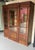 A handsome French late 19th to early 20th century mahogany bookcase of very good quality, featuring three glazed doors...