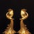 This is a matched pair of impressive antique gilt bronze candlesticks, each exquisitely cast in the form of a phoenix. The...