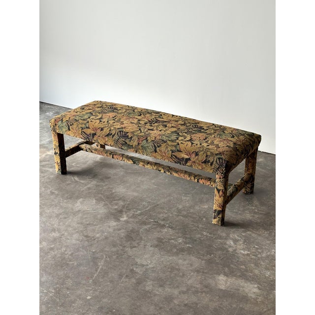 There’s a kind of quiet drama to a piece that hides its bones completely — every inch of this vintage bench, straight...