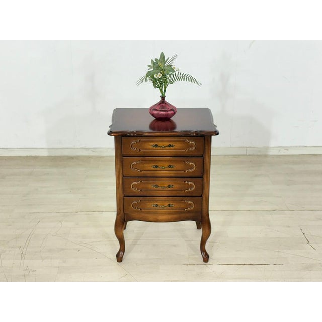Elegant Chippendale-style chest of drawers from the 1960s. This piece of furniture impresses with its classic design,...