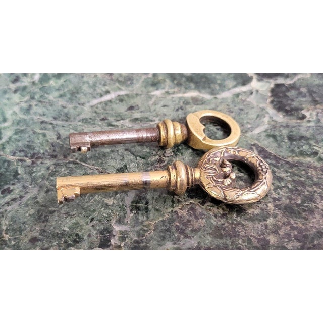 A louis xvi style mahogany and burl wood sideboard, 19th century, opening with three thuya burl doors carved with a...