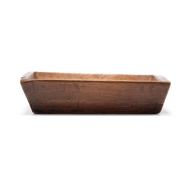 Carved from pine, this hundred-year-old tray made in northern China charms with its rusticity and simple shape. Marked...