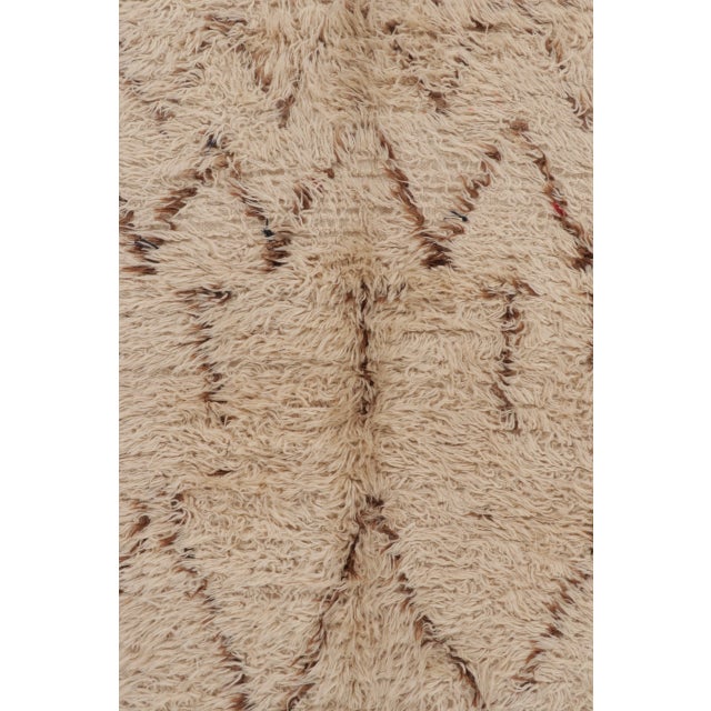 Hand-knotted wool, this vintage 6x11 Moroccan shag runner is a remarkable addition to Rug & Kilim’s collection of high-...