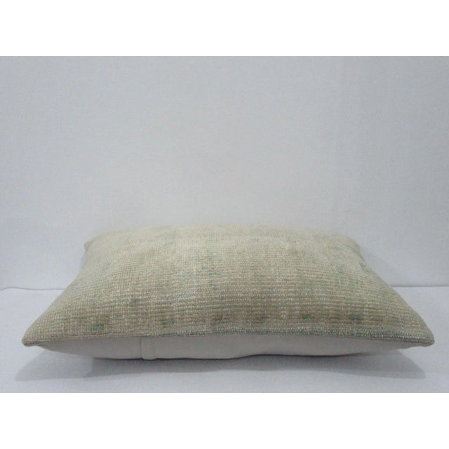 Decorative pillow cover made from a vintage Turkish handknotted rug. Backed with good quality cotton fabric. Pillow...
