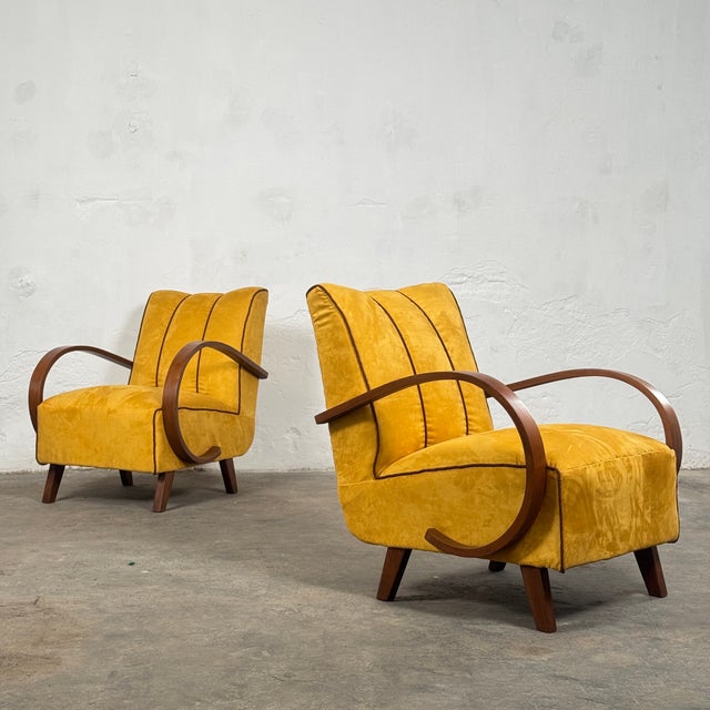 This pair of armchairs is a quintessential example of art deco design, created in the 1930s by the influential czech...
