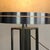 A piece of furniture with extraordinary stage presence and geometric rigor. This monumental table lamp, produced in Italy...