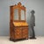 Lombard trumeau in style, crafted from walnut and walnut burl, featuring an upper section with a pair of mirrored doors....