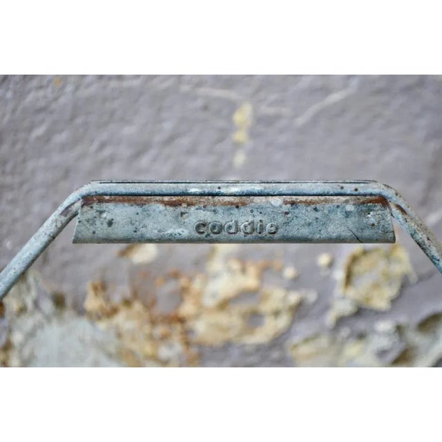 Made of bent metal wire, this vintage Caddie bottle rack has a little industrial look to it. In the kitchen or at the...