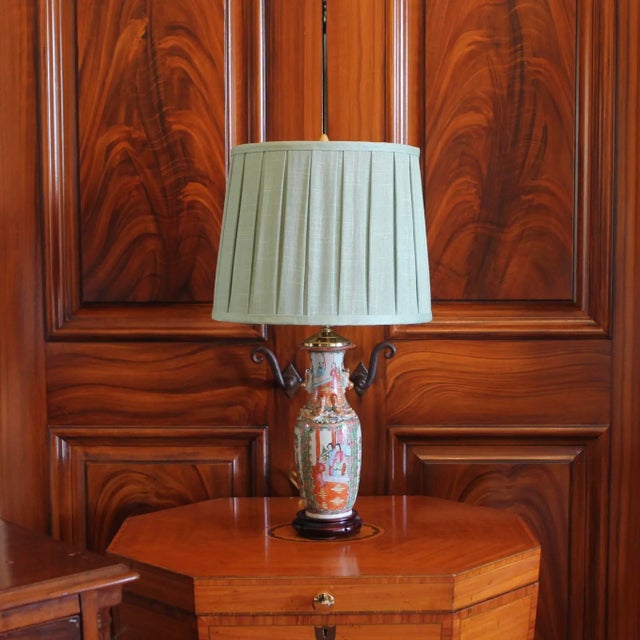 A good Rose Medallion Chinese Export vase adapted into a lamp with a good quality carved wood base and high quality brass...