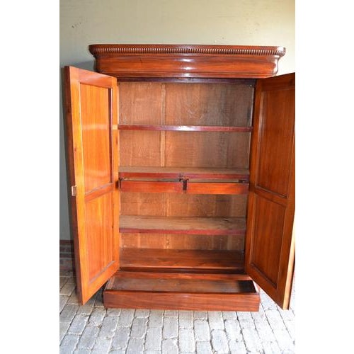 of a 19th-century Dutch mahogany Biedermeier maid's cabinet. The height is 184 cm. The width is 125 cm. The depth is 47...