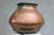 A striking, large-scale copper vessel handcrafted in the Balkans during the late 19th century, reflecting the enduring...