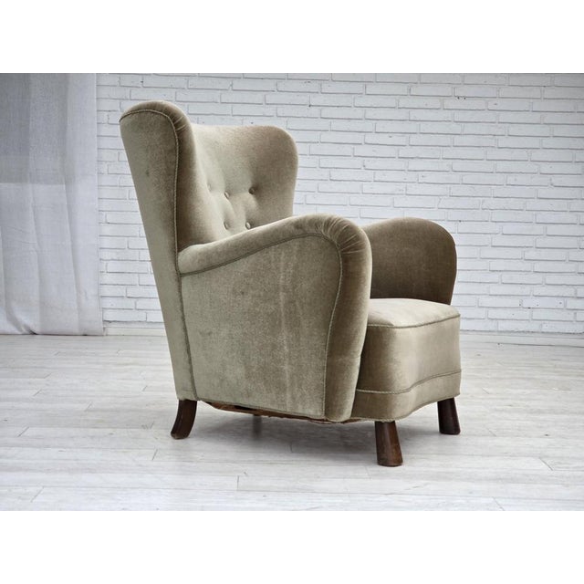 1960s, Danish armchair. Green furniture velour, oak wood legs, brass springs in the seat. Original good condition: no...