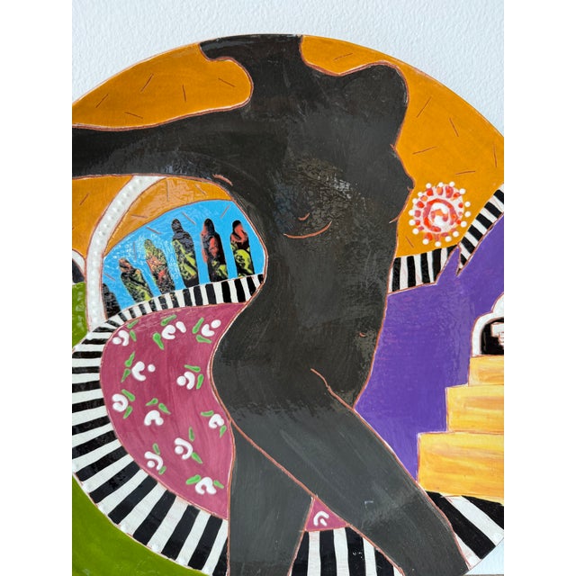 Striking hand-painted ceramic decorative plate by artist Lois Barton, created in the 1980s. This vibrant composition...