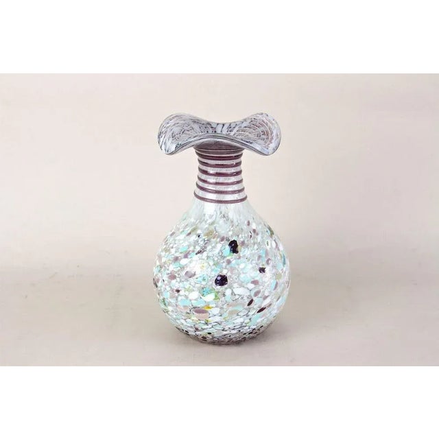 Stunning multicolored Murano glass vase from the midcentury period in Italy. Elaborately handcrafted in the 1950s, this...