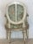 Beautifully hand-carved frame offers generous seat and shaped oval back Legs are tapered and routed. Gilt decoration on...