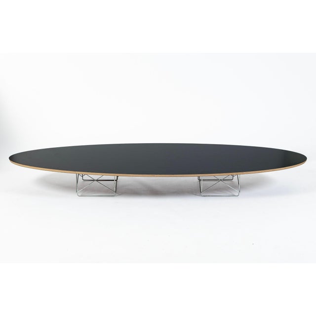 This classic mid century modern Eames ETR (Elliptical Table Rod Base) coffee table by Charles & Ray Eames for Herman...