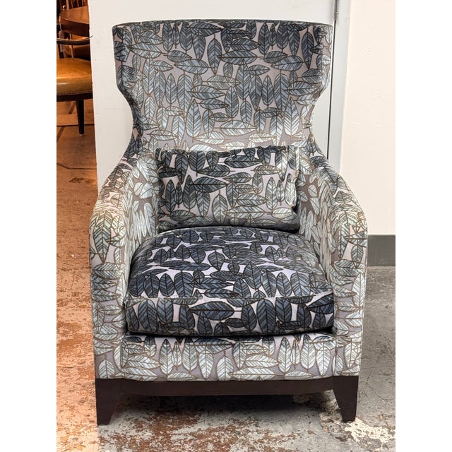 Design Plus Gallery presents a Bespoke Wingback Lounge Armchair. The upholstery combines shades of blue, gray, and...