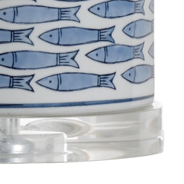 Add a touch of whimsy to your waterfront retreat with fish tail lamp. This 26.5" Table lamp features a blue fish design on...