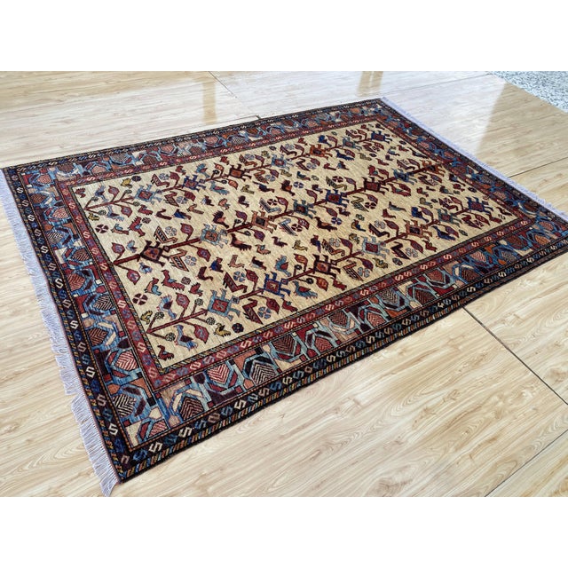 A vintage Afghan rug, hand-knotted in wool in the late 20th century and drawn in the Caucasian tradition, with a repeating...